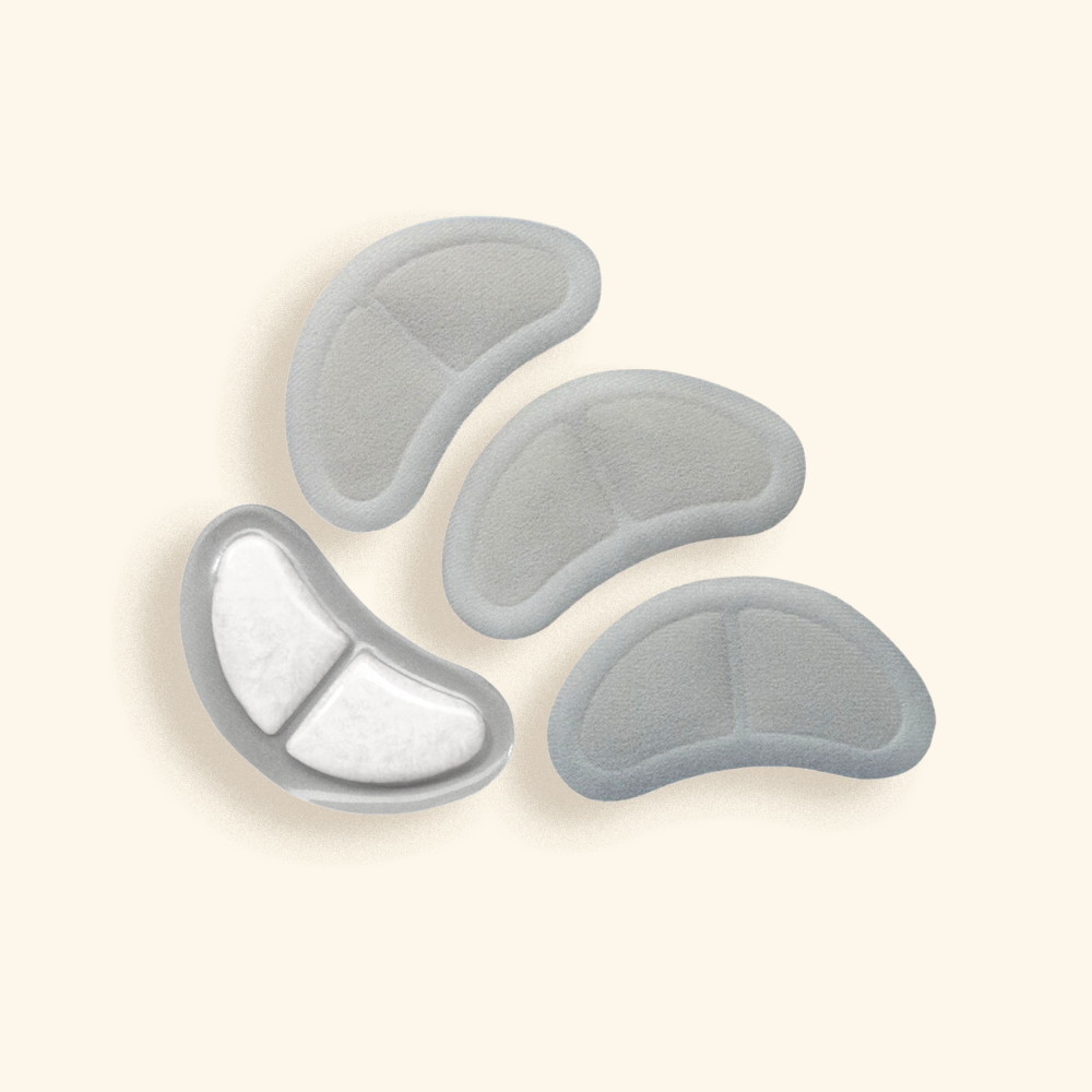Set of four breast friends cooling pads on a beige background