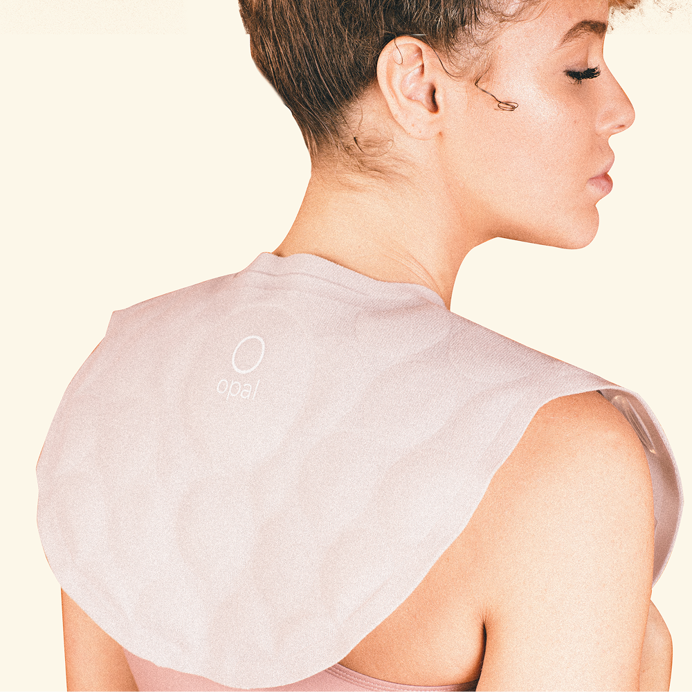 Woman wearing hot flash cape in blush color