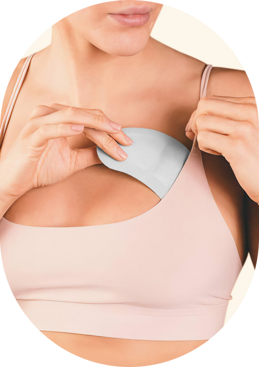 Woman inserting breast friends product into bra