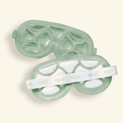 Cooling eye mask with white cooling pods on a beige background