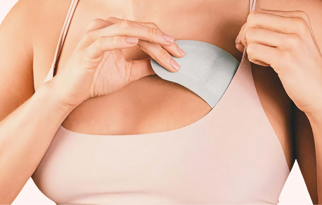 Person putting breast friends product into bra